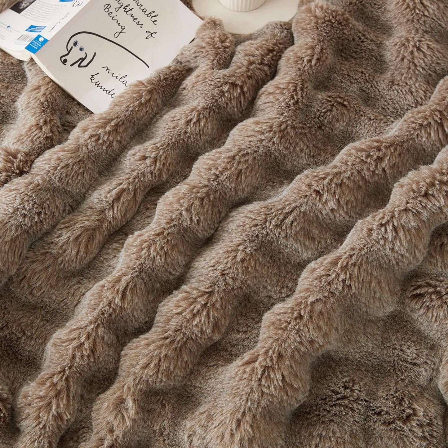 Wonderfully soft, stylish throw that brings warmth, coziness, and elegance together.