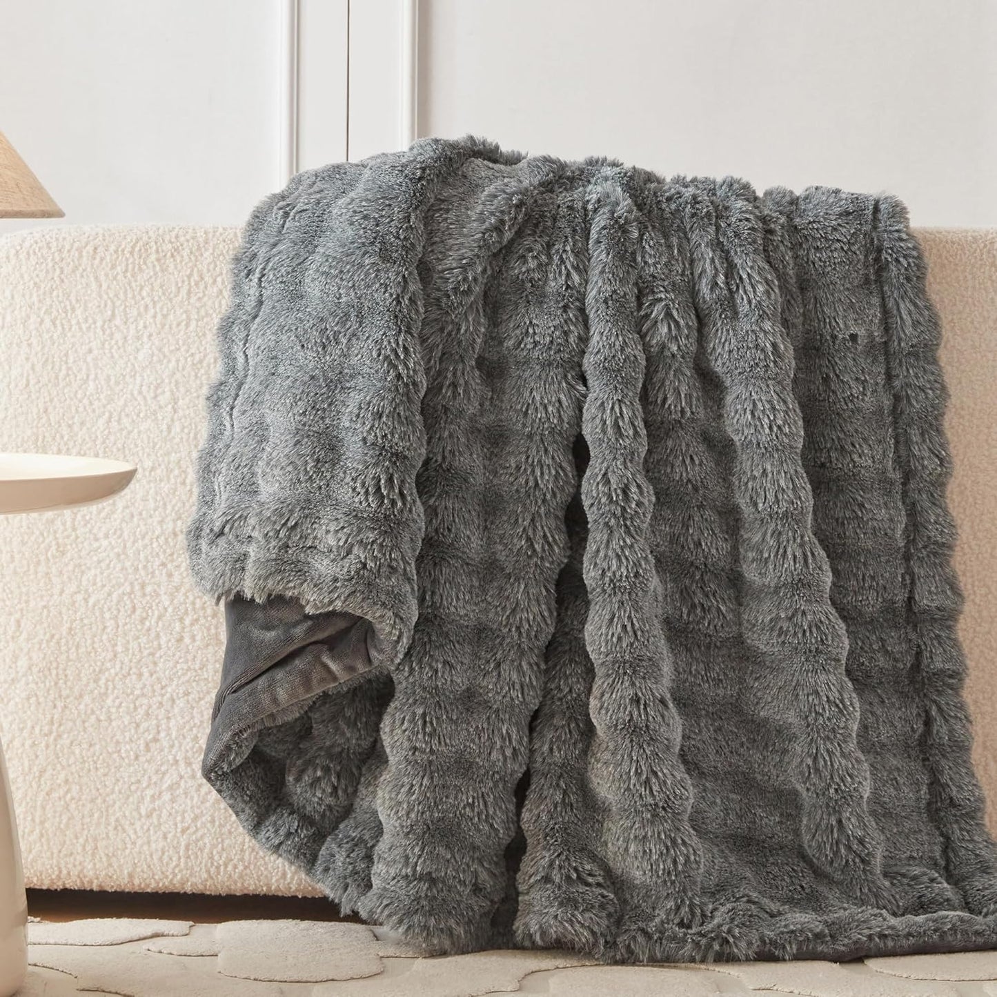 Wonderfully soft, stylish throw that brings warmth, coziness, and elegance together.